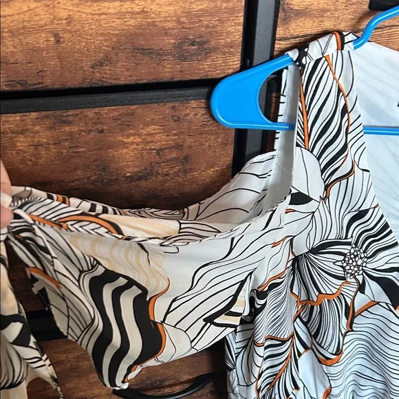 Adelyn Rae Black and Orange Patterned Romper - Picture 3 of 9